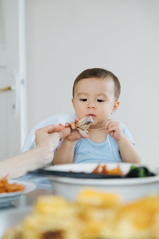 An infant eating food